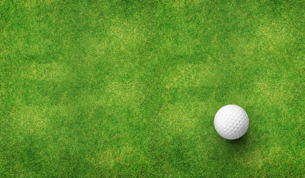 Golf ball on putting green