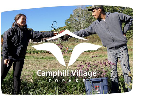 Camphill Village volunteers with logo
