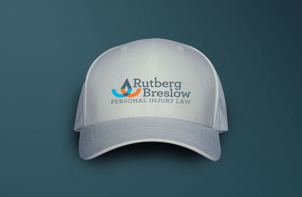 Rutberg Breslow logo on white baseball cap