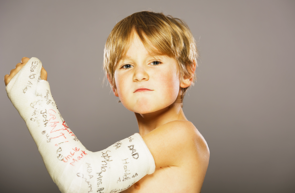 young boy with white cast
